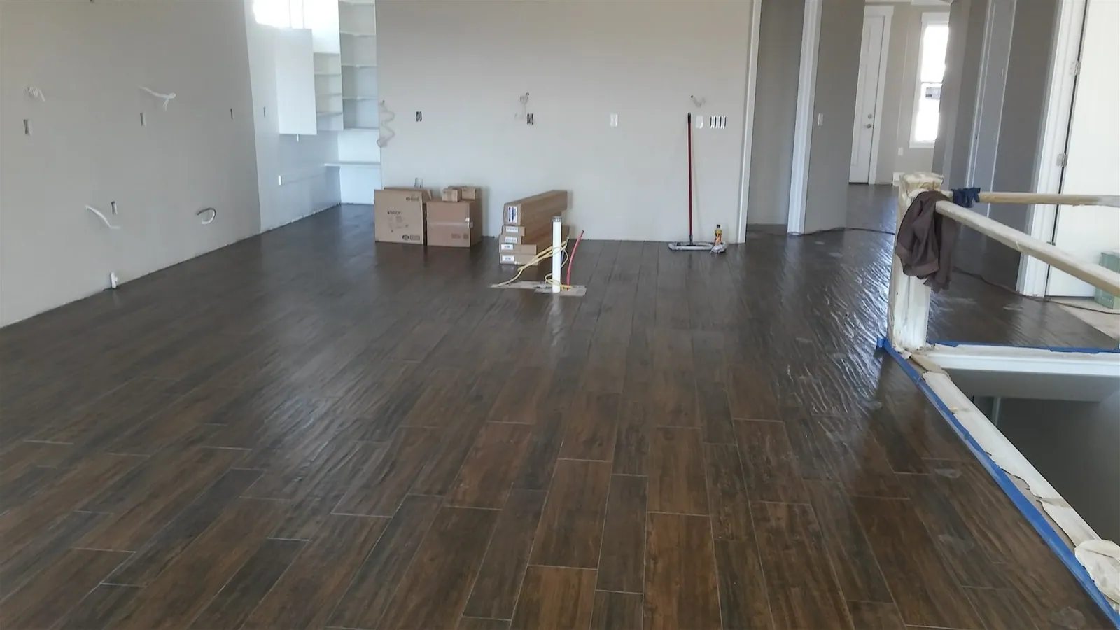 Open living area with dark wood-look plank flooring