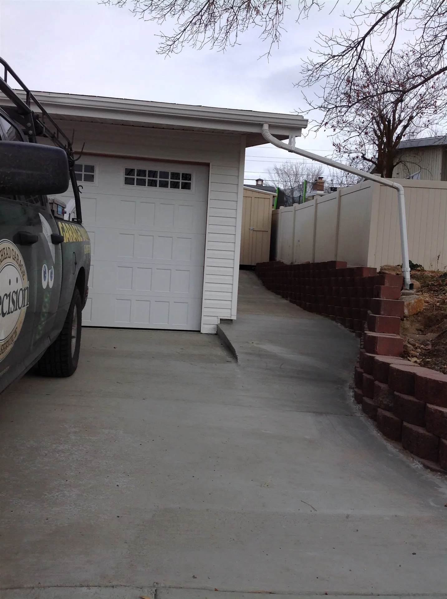 New concrete driveway with brick border