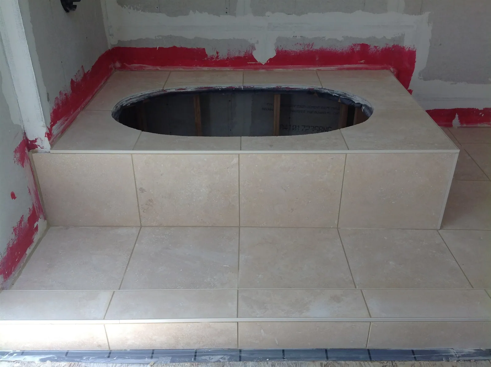Tub deck waterproofed before tile installation