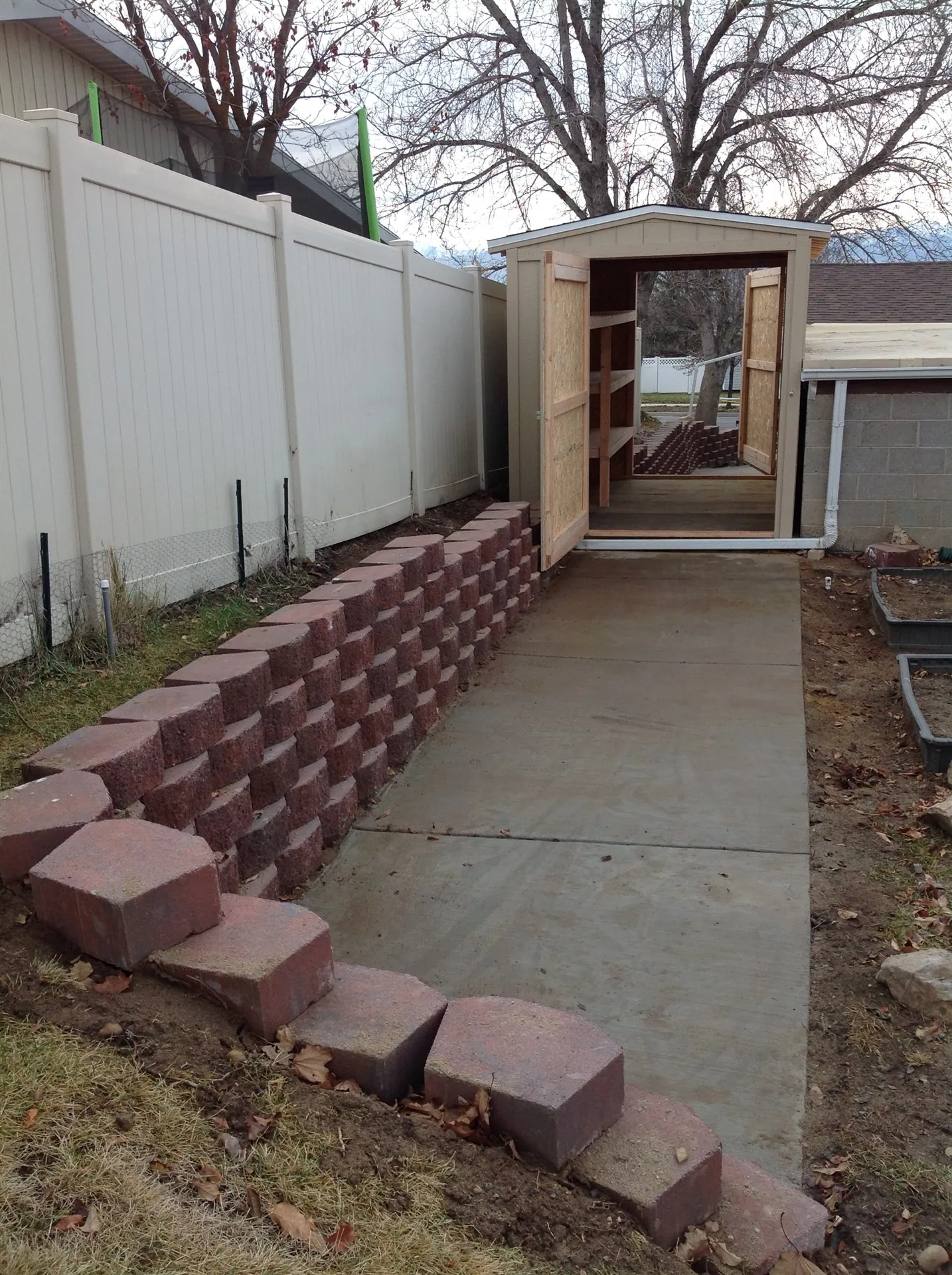 Concrete walkway with brick retaining edge