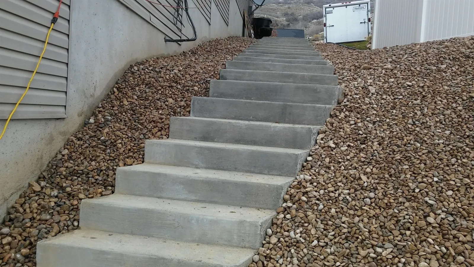 Poured concrete stairs on a graded hillside