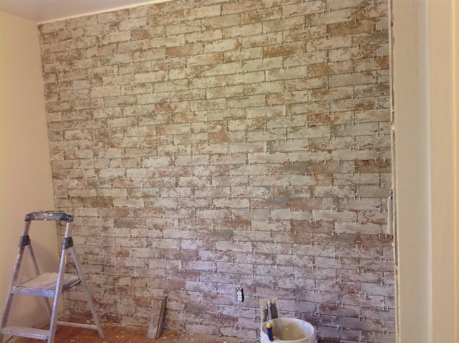 Brick veneer accent wall during installation