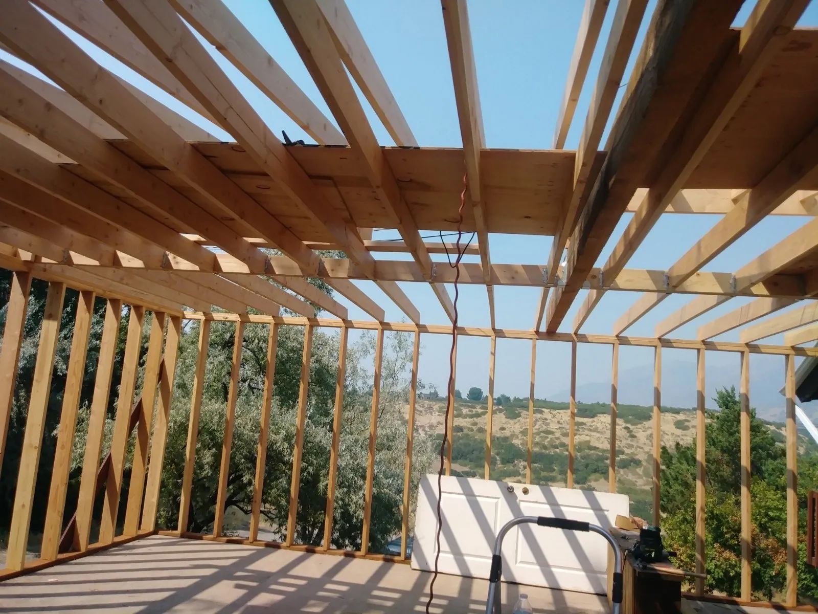 Timber pergola framing over a patio