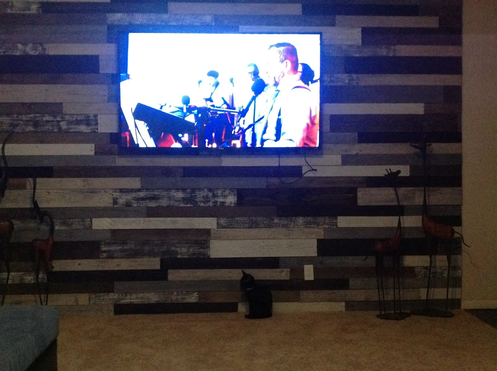 Plank accent wall with mounted television