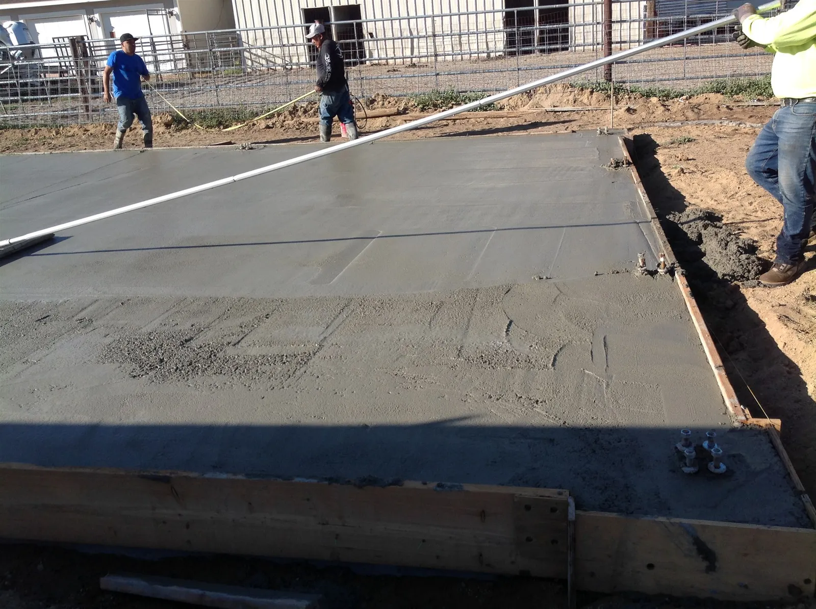 Finishing a freshly poured concrete slab